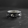 925 sterling silver skull ring with intricate gothic engravings displayed on dark textured background