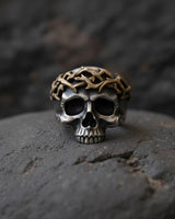 925 sterling silver crown of thorns skull ring with black rhodium plating and intricate thorn details on dark stone surface