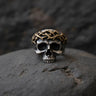 925 sterling silver crown of thorns skull ring with black rhodium plating and intricate thorn details on dark stone surface
