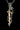 Close-up of the Panther Sword Pendant focusing on the panther's face, red eyes, and the black gemstone on the gold vermeil sword hilt.