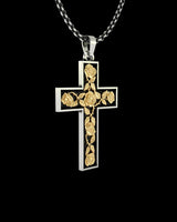 Angled view of the two-tone silver rose cross pendant, highlighting the 3D texture of the gold vermeil roses and vines.