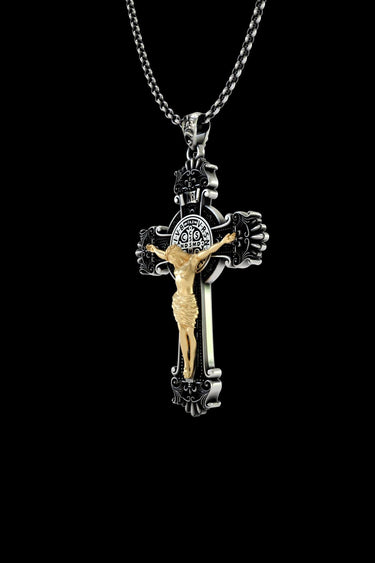 Side angle of Saint Benedict protection pendant displaying ornate religious craftsmanship and chain attachment