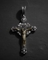 Rose gold plated 925 sterling silver crucifix pendant with INRI inscription on dark slate background
