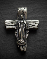 925 sterling silver Virgin Mary cross pendant with gold vermeil finish and detailed wooden texture on dark slate
