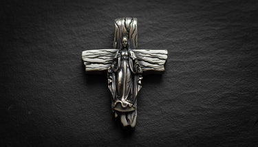 925 sterling silver Virgin Mary cross pendant with gold vermeil finish and detailed wooden texture on dark slate