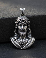 925 sterling silver Jesus Christ pendant with Crown of Thorns detailed craftsmanship on dark stone surface