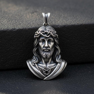 925 sterling silver Jesus Christ pendant with Crown of Thorns detailed craftsmanship on dark stone surface