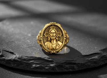 Close-up detail of Jesus Christ portrait engraving with intricate facial features on premium sterling silver ring