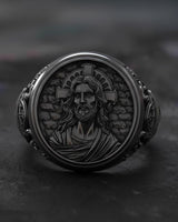 Side angle view of handcrafted Jesus ring showing intricate facial details and religious craftsmanship
