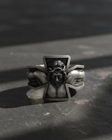 925 sterling silver crucifixion cross ring with detailed Jesus Christ carving on dark surface background