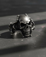 Side angle view of gothic skull ring with flowing octopus tentacles carved in premium sterling silver
