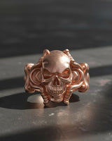 Rose gold version of handcrafted skull tentacle ring showing detailed tentacle wraparound band design