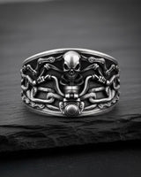 925 sterling silver skull chain ring with detailed motorcycle links displayed on dark slate background