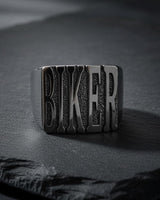 Close-up view of handcrafted BIKER ring with oxidized details and heavy-duty band construction
