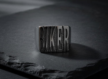 Close-up view of handcrafted BIKER ring with oxidized details and heavy-duty band construction