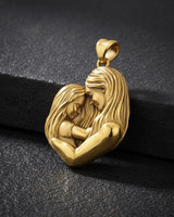 Close-up side view of mother child pendant showing intimate embrace pose and premium metalwork craftsmanship