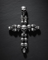 Sterling silver skull cross pendant displaying oxidized finish and premium gothic jewelry design