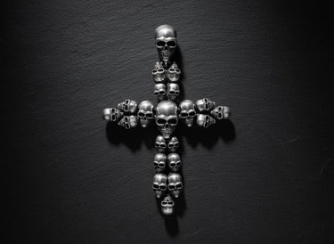 Sterling silver skull cross pendant displaying oxidized finish and premium gothic jewelry design