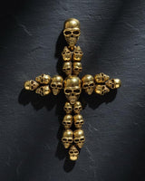 Gothic cross pendant showing intricate skull details and three-dimensional metalwork craftsmanship
