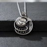925 sterling silver basketball pendant with detailed net design and jersey number 01 on dark background