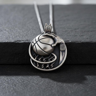 925 sterling silver basketball pendant with detailed net design and jersey number 01 on dark background
