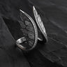 925 sterling silver angel wings ring with sparkling cubic zirconia gems displayed on dark slate background