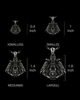 Size comparison chart showing Viking raven pendant in four different sizes from 0.4 to 1.8 inches for scale reference