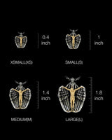 Size comparison chart for the Angel Crucifix Pendant, showing XSMALL, SMALL, MEDIUM, and LARGE options from 0.4 to 1.8 inches.