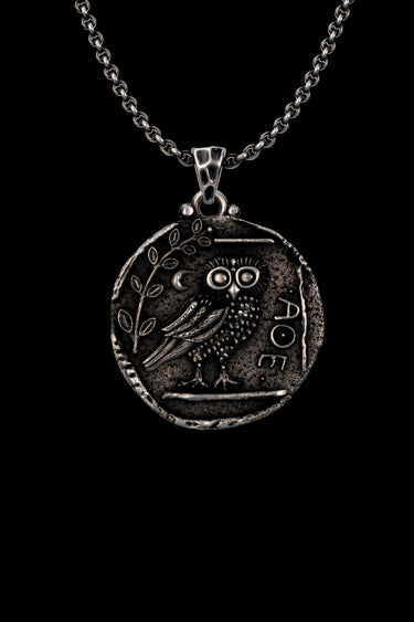 Silver Athena Owl Pendant on a chain, showing the detailed ancient Greek coin design with owl, olive branch, and ΑΘΕ letters.