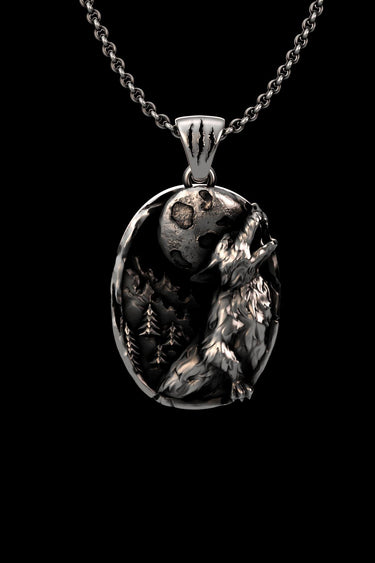 Handcrafted wolf moon pendant in 925 silver. Angled view showing the wolf's textured fur and the unique claw mark bail.