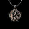 Silver Ram Pendant with oxidized finish, showing detailed horns and ornate filigree border on a sterling silver chain.