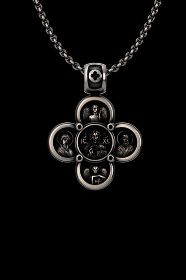 Silver Orthodox cross pendant featuring a central icon of Jesus Christ, flanked by Mary and John the Baptist on a chain.