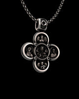 Angled view of the handcrafted Byzantine cross pendant in 925 sterling silver, showing the depth and detail of the icons.