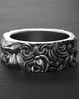 Close-up detail of Moses sculpture ring displaying craftsmanship and religious symbolism on sterling silver band