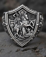 Sterling silver dragon signet ring with oxidized finish displaying intricate medieval craftsmanship and heraldic shield shape