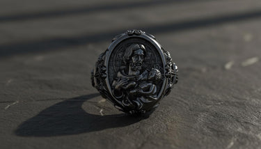 Detailed view of handcrafted Saint Joseph Catholic ring showing golden highlights and religious cross motifs on silver band