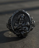 Side angle view of handcrafted Catholic St Joseph ring showing intricate Gothic border design and oxidized details