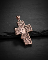 Rose gold Jesus cross pendant displaying warm metallic finish and sacred religious craftsmanship detail