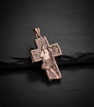 Rose gold Jesus cross pendant displaying warm metallic finish and sacred religious craftsmanship detail