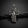 925 sterling silver Jesus cross pendant with detailed Christ profile and wood-grain texture on dark slate background