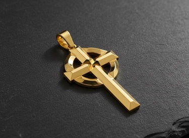Gold vermeil Celtic cross pendant with geometric knotwork design on dark textured background showing fine detail