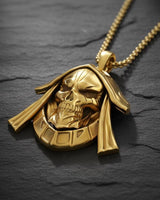 Side angle view of gothic skull pendant showing detailed hood and skeletal features in oxidized sterling silver