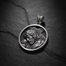 925 sterling silver Jesus carrying cross pendant with detailed relief sculpture on dark slate background