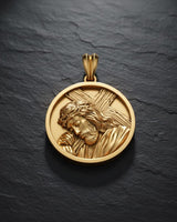 Close-up of handcrafted Jesus bearing cross pendant with oxidized finish highlighting sacred religious design