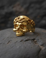 Close-up detail of crown of thorns design with twisted silver thorns surrounding skull on premium 925 sterling silver ring