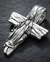 Side angle of sterling silver Virgin Mary pendant displaying dimensional craftsmanship and cross thickness detail