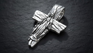 Side angle of sterling silver Virgin Mary pendant displaying dimensional craftsmanship and cross thickness detail