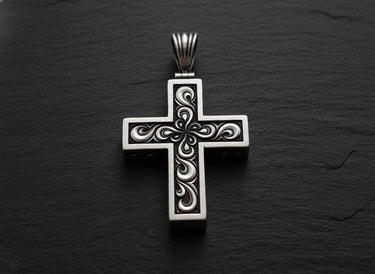 925 sterling silver cross pendant with intricate baroque filigree openwork design on dark textured background