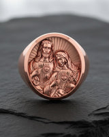 Sacred Hearts signet ring in rose gold showing detailed religious engravings of Jesus and Mary hearts