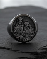 Sterling silver Catholic ring with Sacred Hearts design featuring sunburst pattern on dark background